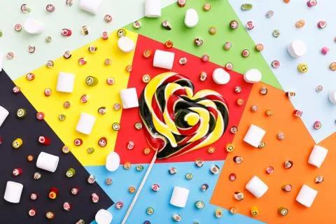 Lollipops, candy pattern, top view flat lay on colorful background Stock Photos