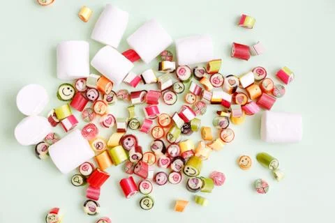Lollipops, candy pattern, top view flat lay on colorful background Stock Photos