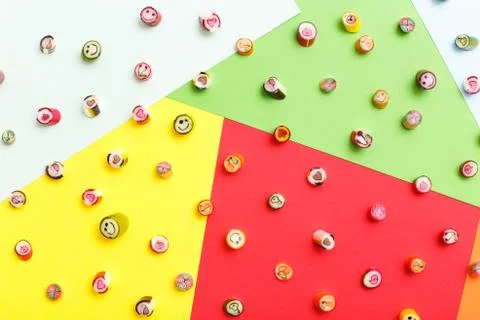 Lollipops, candy pattern, top view flat lay on colorful background Stock Photos