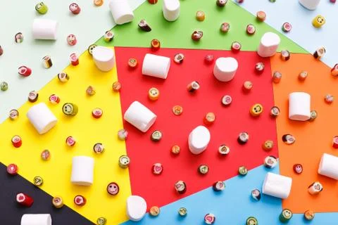 Lollipops, candy pattern, top view flat lay on colorful background Stock Photos