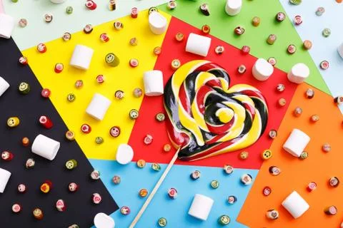 Lollipops, candy pattern, top view flat lay on colorful background Stock Photos