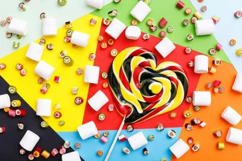 Lollipops, candy pattern, top view flat lay on colorful background Stock Photos