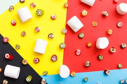 Lollipops, candy pattern, top view flat lay on colorful background Stock Photos