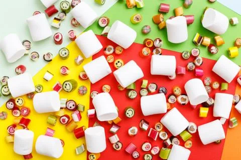 Lollipops, candy pattern, top view flat lay on colorful background Stock Photos