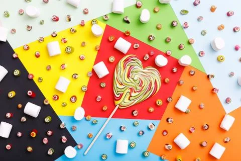 Lollipops, candy pattern, top view flat lay on colorful background Stock Photos
