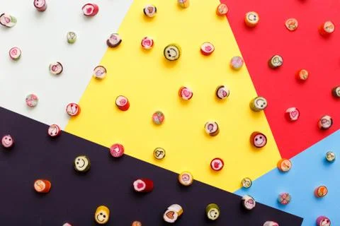 Lollipops, candy pattern, top view flat lay on colorful background Stock Photos