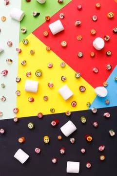 Lollipops, candy pattern, top view flat lay on colorful background Stock Photos