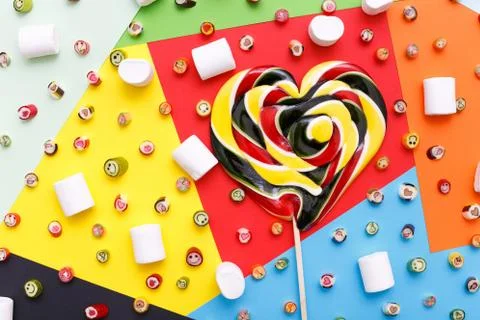 Lollipops, candy pattern, top view flat lay on colorful background Stock Photos
