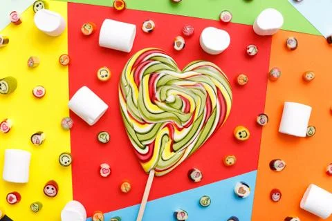 Lollipops, candy pattern, top view flat lay on colorful background Stock Photos