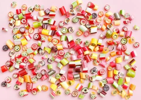 Lollipops, candy pattern, top view flat lay on colorful background Stock Photos