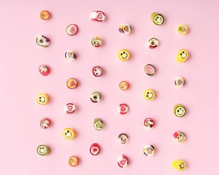 Lollipops, candy pattern, top view flat lay on colorful background Stock Photos