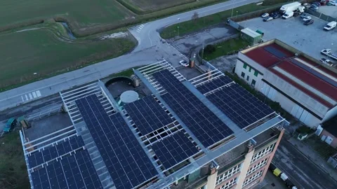 Lombardy Italy multi-storey building solar panel array rooftop renewable en.. Stock Footage 325727692