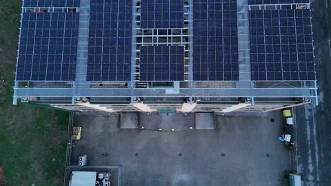Lombardy Italy multi-storey building solar panel array rooftop renewable en.. Stock Footage 325728053