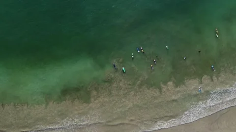 Lombok's Coastal Symphony: Top-Down to Panoramic Soar Over Indonesia's Beach Stock Footage 259474864