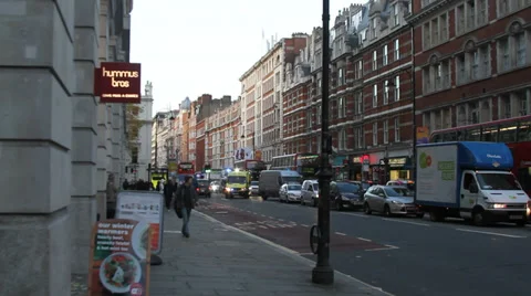 London ambulance pulls out of traffic Stock Footage 33444050