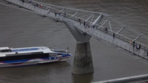 London boat under millenium bridge Stock Footage 92581300