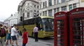 London British Red Telephone Box Busy City Car Traffic People Walking Rush Hour HD Footage