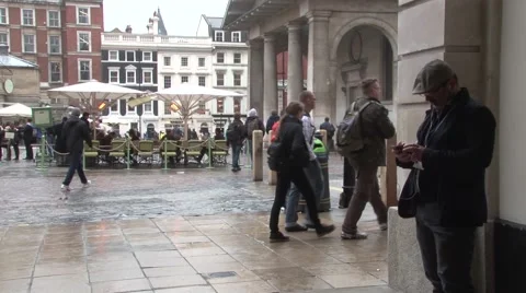 London BRoll-1-Man using iPhone at square Video stock 40541735