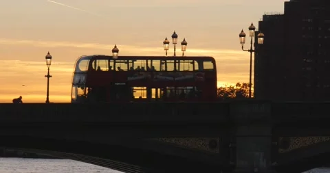LONDON BUS ON BRIDGE AT SUNSET TIME Stock Footage