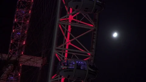 London eye at night with moon in background Stock Footage 86837831