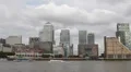 London Financial Hub Canary Wharf Skyline Thames River Touristic Ferry Boat Ship HD Footage