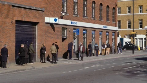 London long queue outside bank during Covid-19, morning sunny Stock Footage 129044338