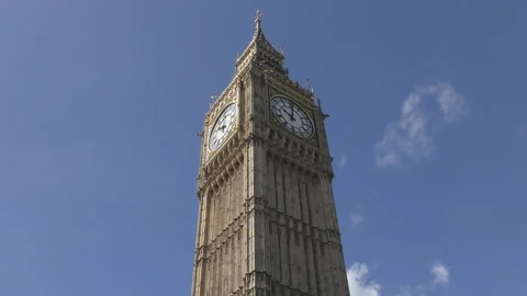 London.  A low angle shot of the Big Ben under blue sky. Stock Footage 99453837