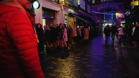 London at night  - clubbers queue outside nightclub - 200FPS Stock Footage