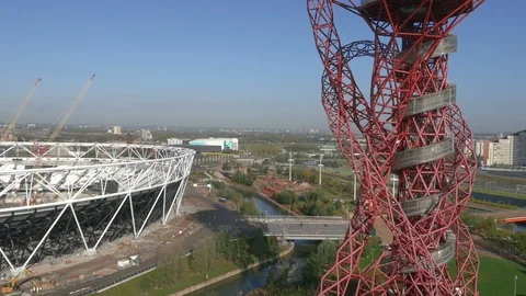 London Olympic ArcelorMittal Orbit and London Stadium aerial pull back 4k Stock Footage 106985072