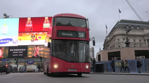 London Red Double Decker buses pass piccadilly circus slow camera pan Stock Footage 57106415
