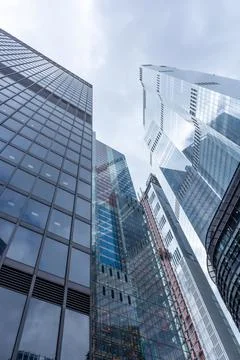 London, reflection of clouds in the windows of modern buildings Stock Photos