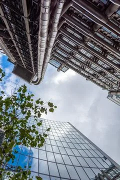 London, reflection of clouds in the windows of modern buildings Stock Photos
