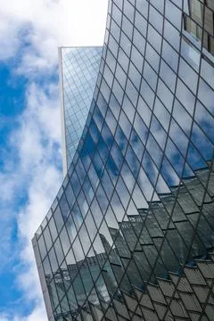 London, reflection of clouds in the windows of modern buildings Stock Photos