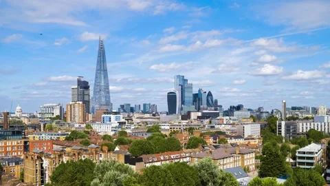 London skyline timelapse from an elevated viewpoint with blue sky and Video stock 139848554