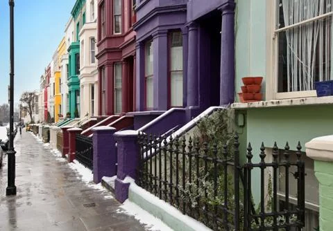London street with colorful houses during winter day Stock Photos