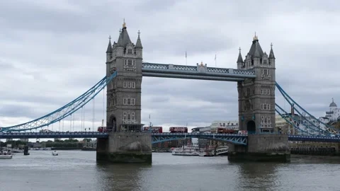 London Tower Bridge with red double decker buses crossing Stock Footage 205553560