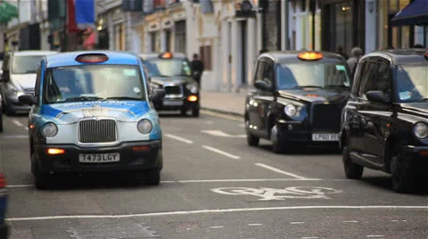 London traffic with black cabs Stock Footage