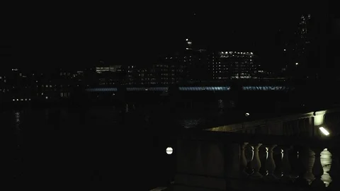 London train over Thames river at night Stock Footage 126553719