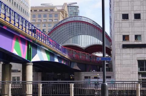 London, UK: a DLR train running towards Heron Quays Station Stock Photos