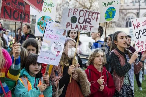 LONDON, UK - February 15, 2019: Protestors at a Youth strike for climate marc Stock Photos