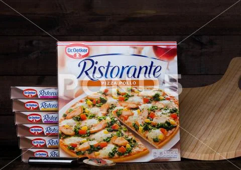 LONDON, UK - MARCH 01, 2018: Boxes of Dr.Oetker Pizza Pollo on wood Stock Photos