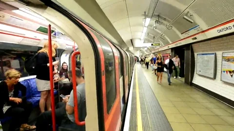 LONDON, UK  People entering underground train in subway station Stock Footage