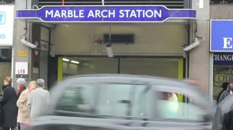 London Underground sign and red bus- Marble Arch Station Stock Footage