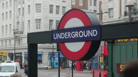 London Underground sign with busy background Stock Footage