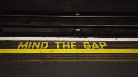 London Underground train approaching the platform - Mind the Gap! Stock Footage 146388576