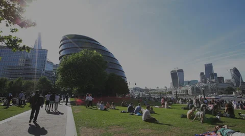 Londoners Relaxing with City Hall Stock Footage