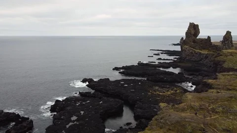 Lóndrangar rock pinnacles over a cliff in Iceland Stock Footage 169917346
