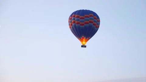 Lone Balloon Hovers in Sky. Flame Jet Maintains Temperature of Air in Ball. Fly Stock Footage 156225423