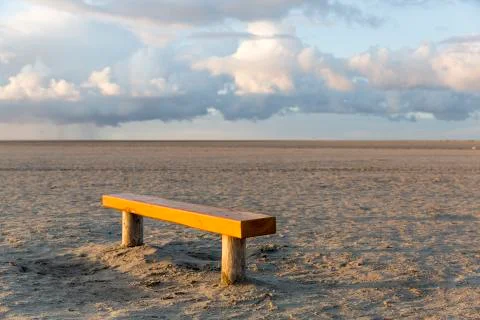 Lone bench on the beach Stock Photos