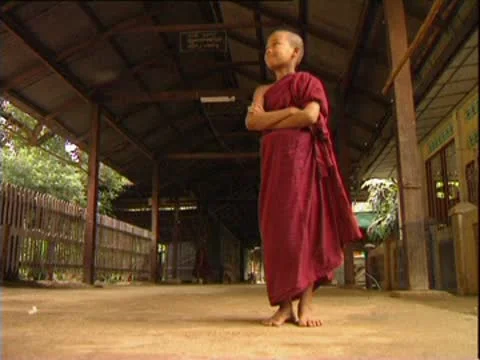 Lone boy barefoot monk, Rangoon, Burma. Stock Footage 10585318